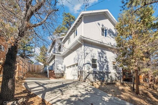 rear view of property with a garage