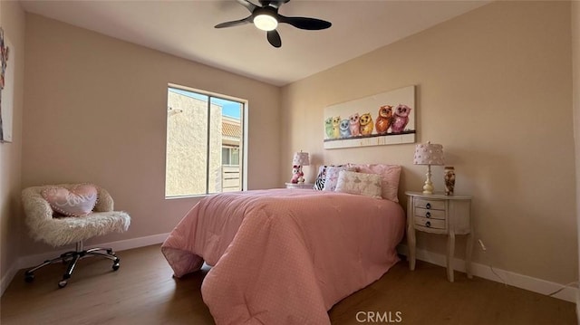 bedroom with ceiling fan and hardwood / wood-style floors