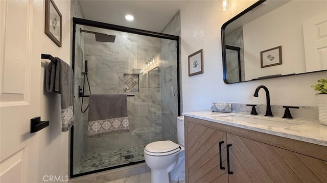 bathroom featuring vanity, toilet, and walk in shower