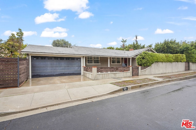 ranch-style home featuring a garage