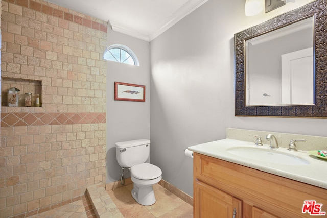 bathroom with vanity, tile patterned floors, ornamental molding, and toilet