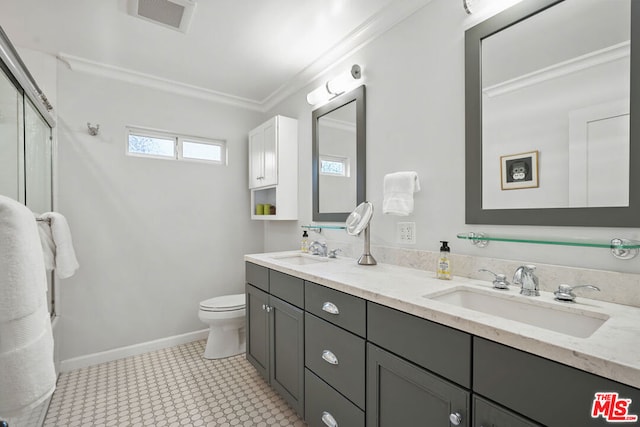 bathroom with crown molding, vanity, and toilet