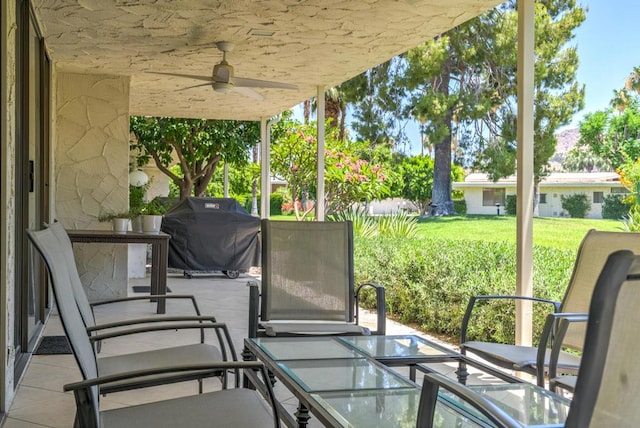 view of patio with a grill and ceiling fan