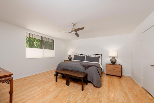 bedroom featuring ceiling fan and light hardwood / wood-style flooring