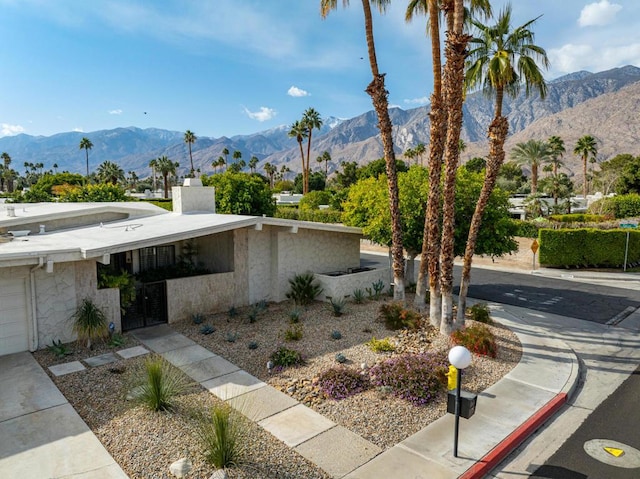 exterior space featuring a mountain view and a garage