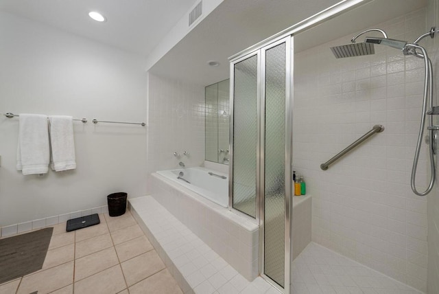 bathroom featuring tile patterned flooring and independent shower and bath