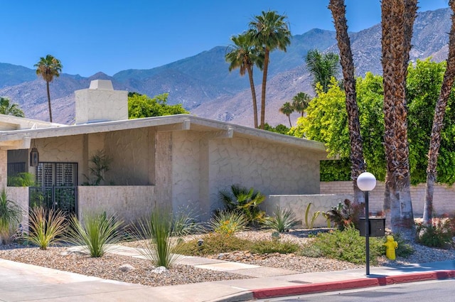 view of property exterior featuring a mountain view