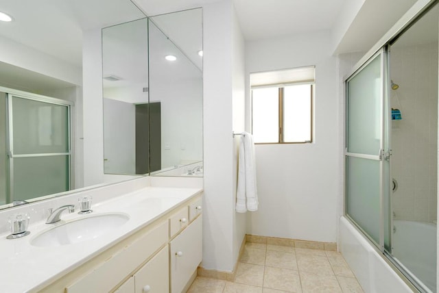 bathroom with tile patterned flooring, vanity, and shower / bath combination with glass door