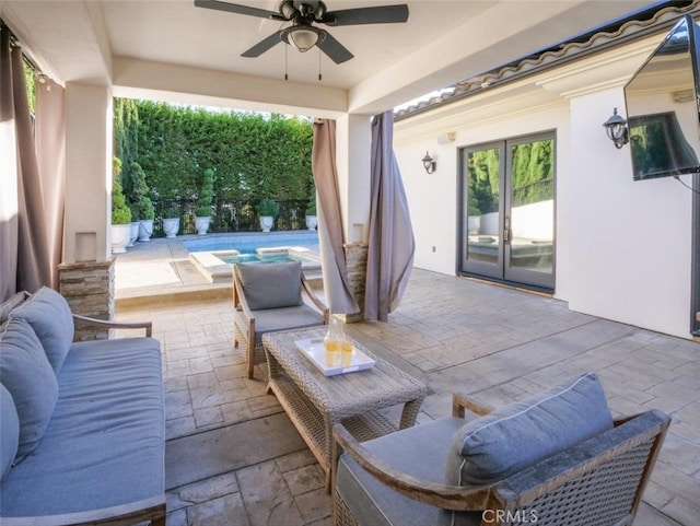 view of patio / terrace featuring a fenced in pool, ceiling fan, and french doors