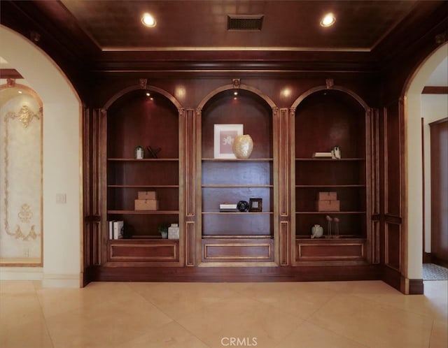 room details with ornamental molding and built in shelves