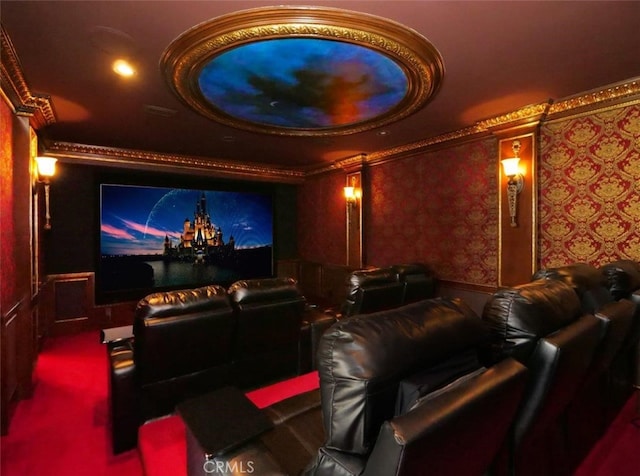 cinema room with ornamental molding and carpet floors