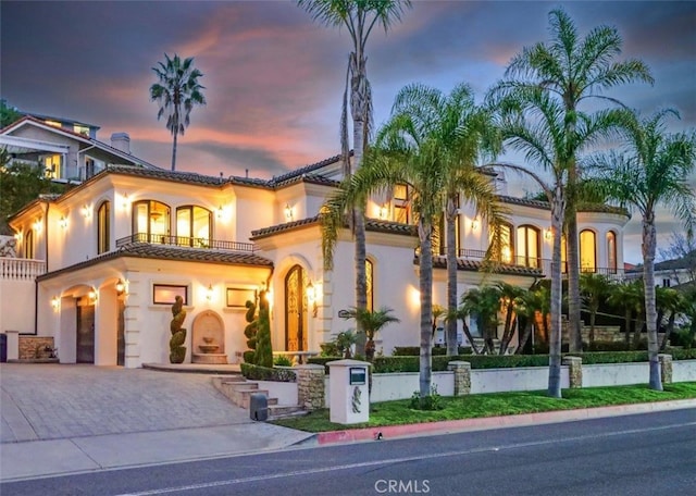 mediterranean / spanish home featuring a balcony