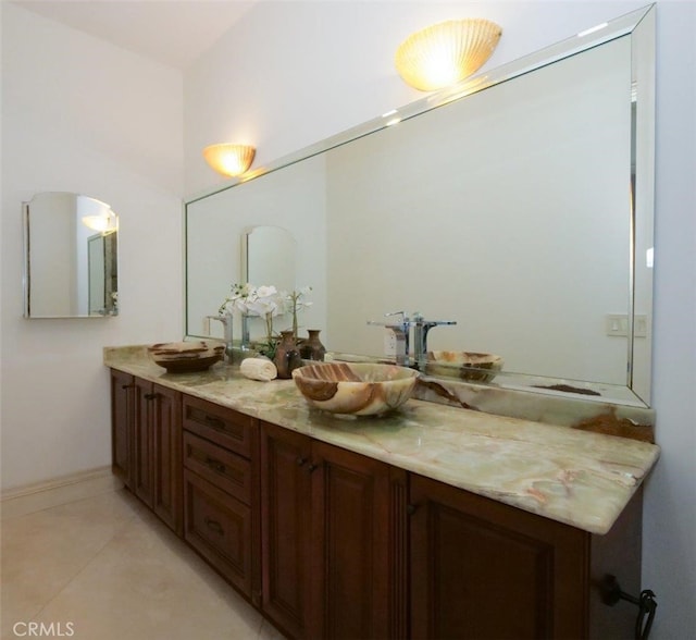 bathroom featuring tile patterned flooring and vanity