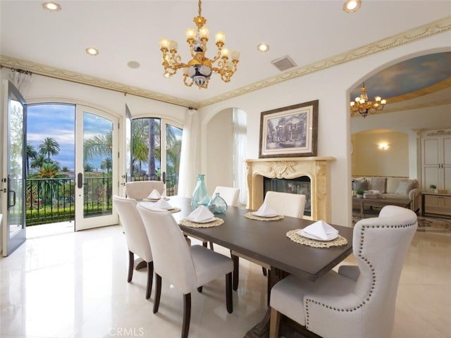 tiled dining area with an inviting chandelier