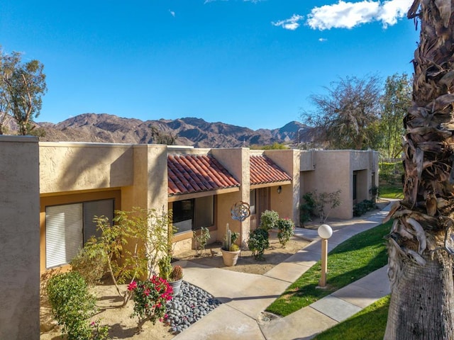 pueblo revival-style home with a mountain view