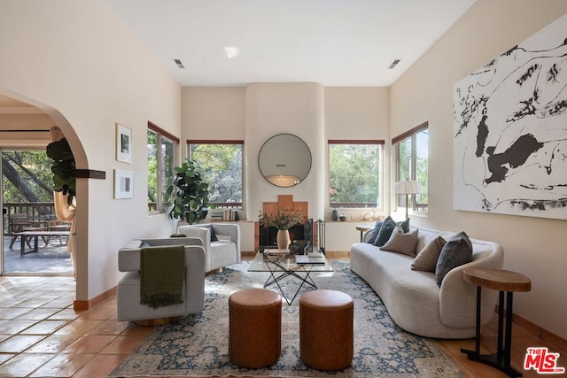 living room with light tile patterned floors and plenty of natural light