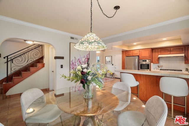 dining room featuring ornamental molding