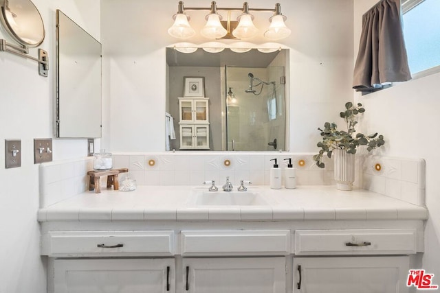 bathroom featuring vanity and a tile shower