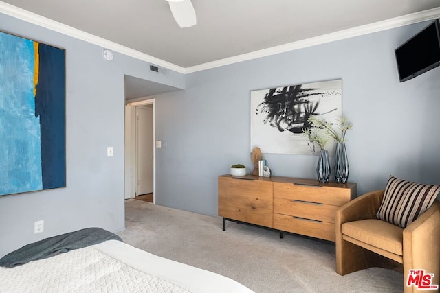 bedroom with crown molding, light carpet, and ceiling fan