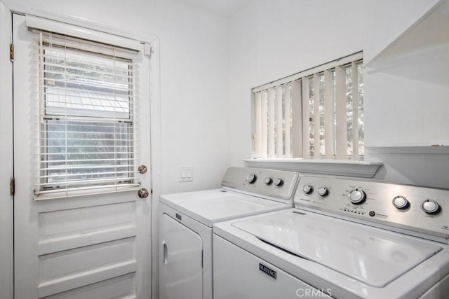 washroom featuring independent washer and dryer