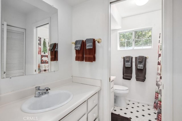 bathroom with vanity and toilet