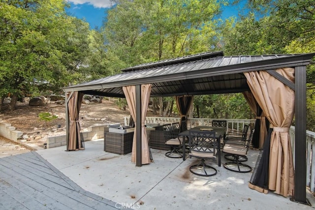 view of patio / terrace featuring a gazebo and a wooden deck