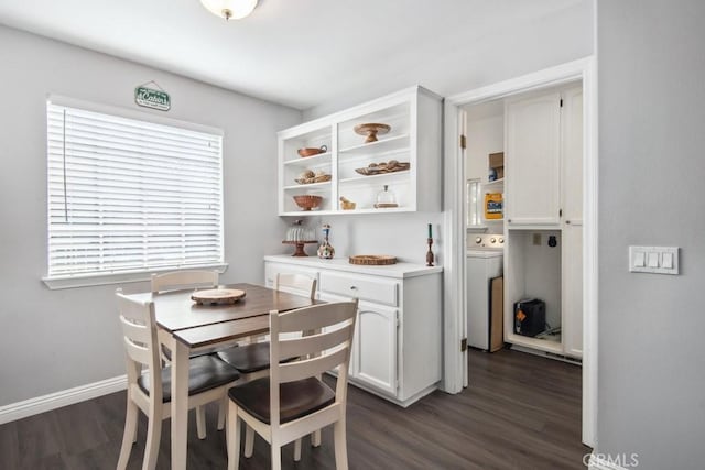 dining area featuring washer / dryer and dark hardwood / wood-style floors