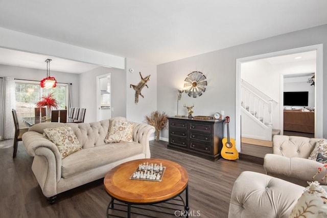 living room featuring dark wood-type flooring