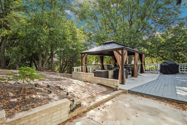 deck featuring a gazebo and a grill