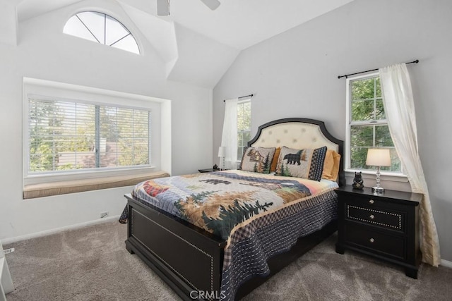 bedroom featuring ceiling fan, lofted ceiling, and dark colored carpet