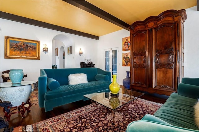 living room featuring beam ceiling and wood-type flooring