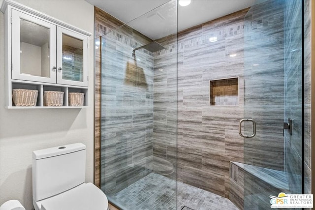 bathroom with toilet and walk in shower