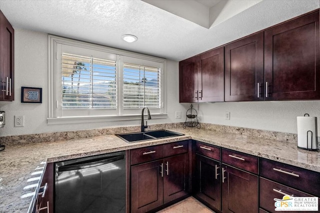 kitchen with sink, a textured ceiling, dishwashing machine, and light stone counters