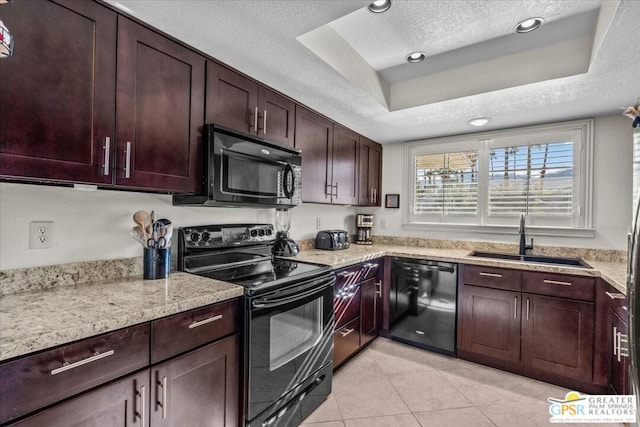 kitchen with sink, black appliances, light stone countertops, a textured ceiling, and a raised ceiling