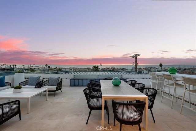 patio terrace at dusk with an outdoor hangout area