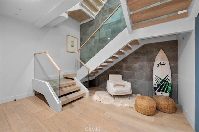 stairs with hardwood / wood-style floors