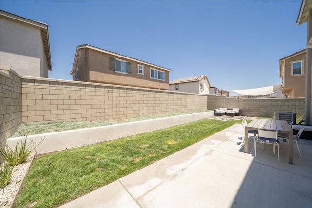 view of yard with an outdoor living space and a patio area