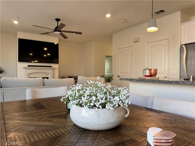 dining area with ceiling fan