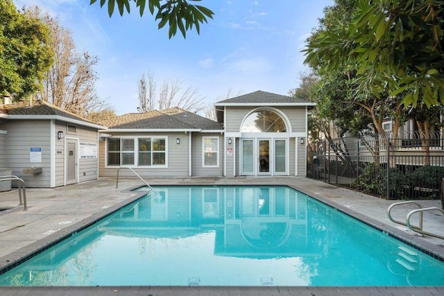 view of pool featuring an outdoor structure and a patio area