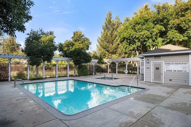 view of pool featuring a pergola and a patio