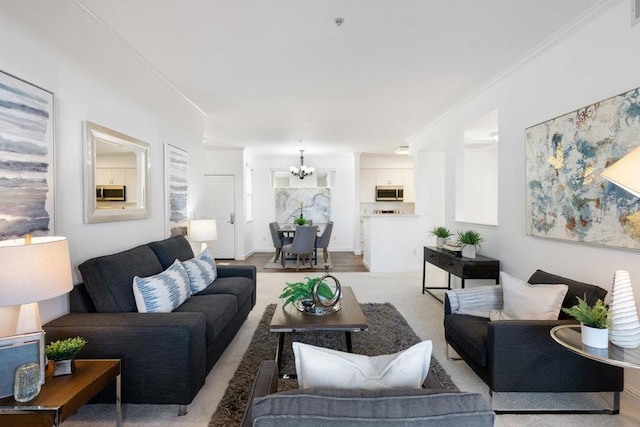 living room featuring a notable chandelier and ornamental molding