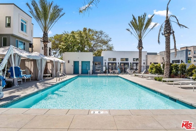 view of swimming pool featuring a patio