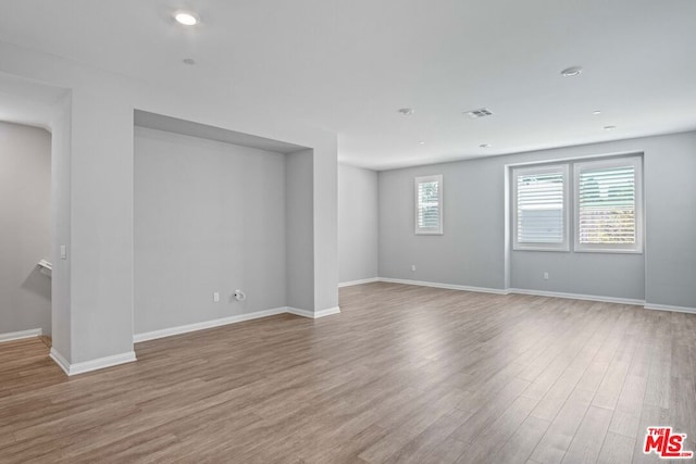 empty room featuring hardwood / wood-style flooring