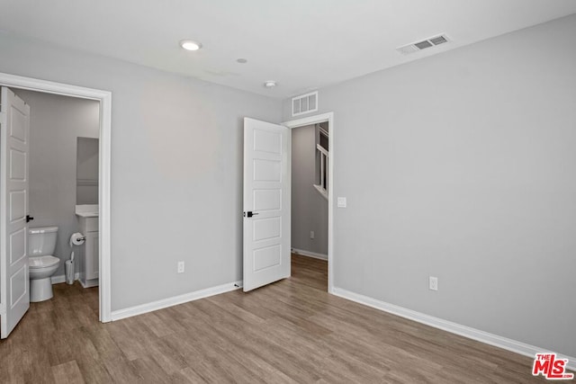 unfurnished bedroom with light hardwood / wood-style flooring