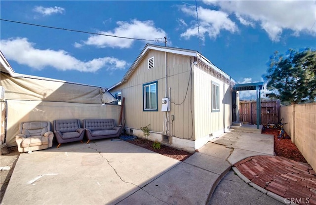 view of property exterior featuring a patio area