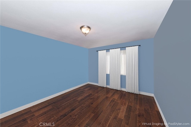 empty room featuring dark hardwood / wood-style flooring