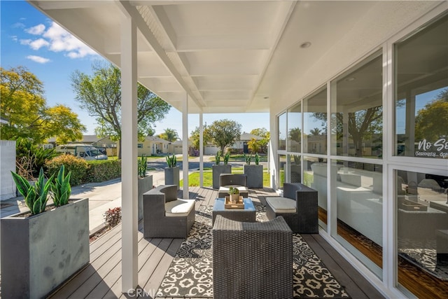 wooden terrace featuring outdoor lounge area