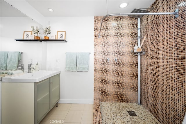 full bathroom with a stall shower, recessed lighting, vanity, and baseboards