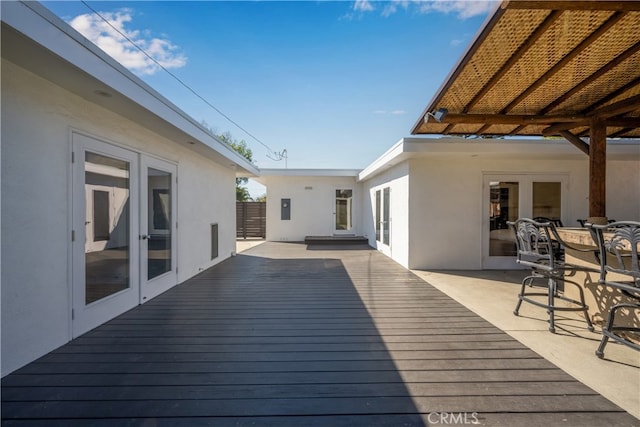 wooden deck featuring french doors