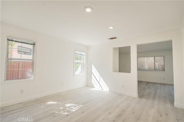 unfurnished room featuring light wood-type flooring